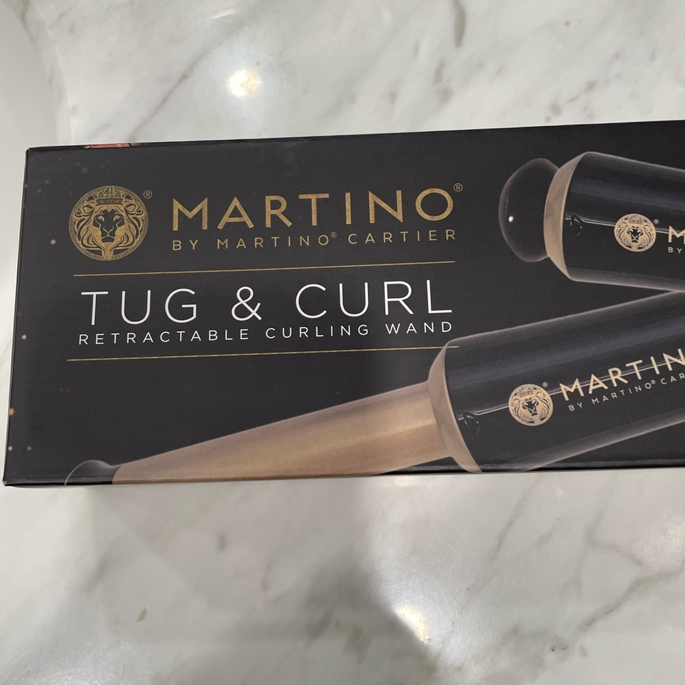 Martino cartier tug and curl retractable curling wand. Perfect for travel